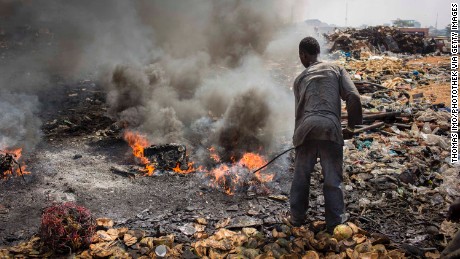 A man burns electronic waste on the biggest electronic scrap yard of Africa in Agbogbloshie, a district of the Ghanaian capital. 