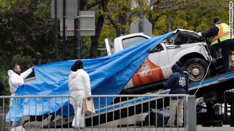 The Home Depot truck used in the bike path attack is removed from the crime scene, Wednesday, Nov. 1, 2017, in New York. (AP Photo/Mark Lennihan)