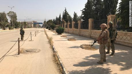 Troops stand in central Deir Ezzor after ISIS was driven from key areas in September.