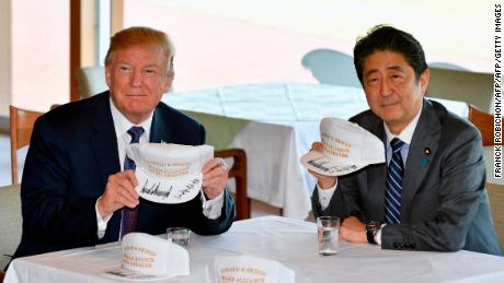 Shinzo Abe surprises Trump with custom hats