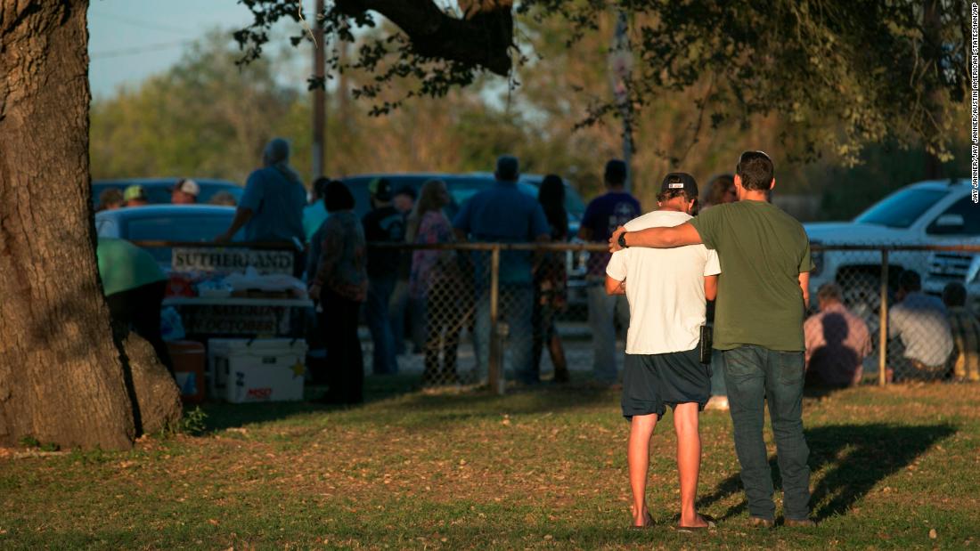 People comfort each other at a community center near the scene of the deadly shooting. 