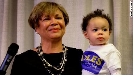 Vi Lyles, Charlotte&#39;s Democratic mayor pro tem, listens to the applause of supporters with her granddaughter following her victory on Tuesday.