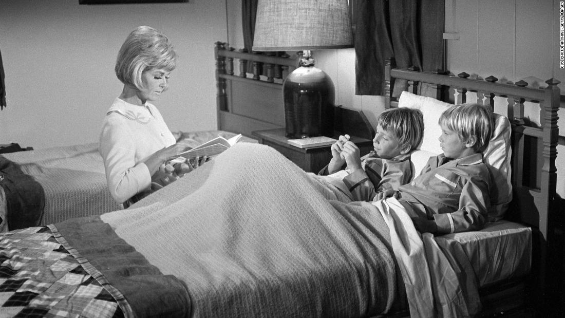 Day reads a bedtime story during a scene from &quot;The Doris Day Show&quot; in 1969. Day starred in the TV sitcom from 1968-1973.