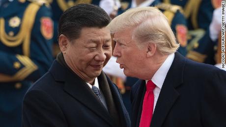 China&#39;s President Xi Jinping (L) and US President Donald Trump attend a welcome ceremony at the Great Hall of the People in Beijing on November 9, 2017.  / AFP PHOTO / NICOLAS ASFOURI        (Photo credit should read NICOLAS ASFOURI/AFP/Getty Images) 