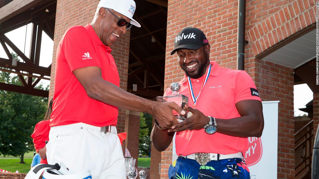 Allen and NBA Hall of Famer Julius Erving pose for a picture at the Julius Erving Golf Classic at The ACE Club, Pennsylvania in September. Allen&#39;s big hitting, colorful clothing and enthusiastic celebrations are helping raising the profile of long drive competitions.