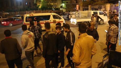 People gather at Sulaymaniyah Hospital in northern Iraq after a major earthquake Sunday. 