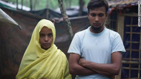 Hasina, left, and her husband Shahidul on October 8. They say soldiers burned their one-year-old daughter alive.