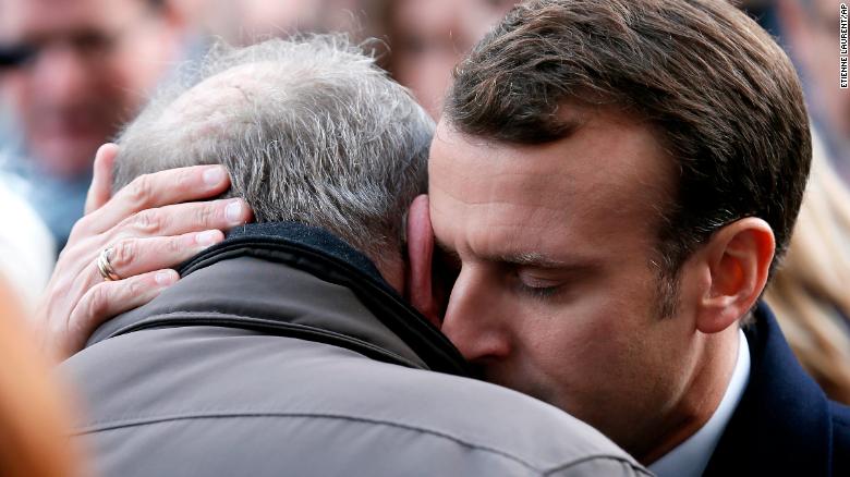 French President Emmanuel Macron hugs a relative of a victim at the Bataclan concert hall during a ceremony marking the second anniversary of the Paris attacks, Monday Nov.13 2017. In silence and tears, families of France&#39;s deadliest terrorist attacks stood alongside President Emmanuel Macron to honor the 130 people killed two years ago Monday, when Islamic State extremists attacked the City of Light. (Etienne Laurent, Pool via AP)
