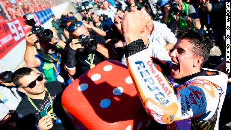 Marquez celebrates his sixth overall world title in Valencia.