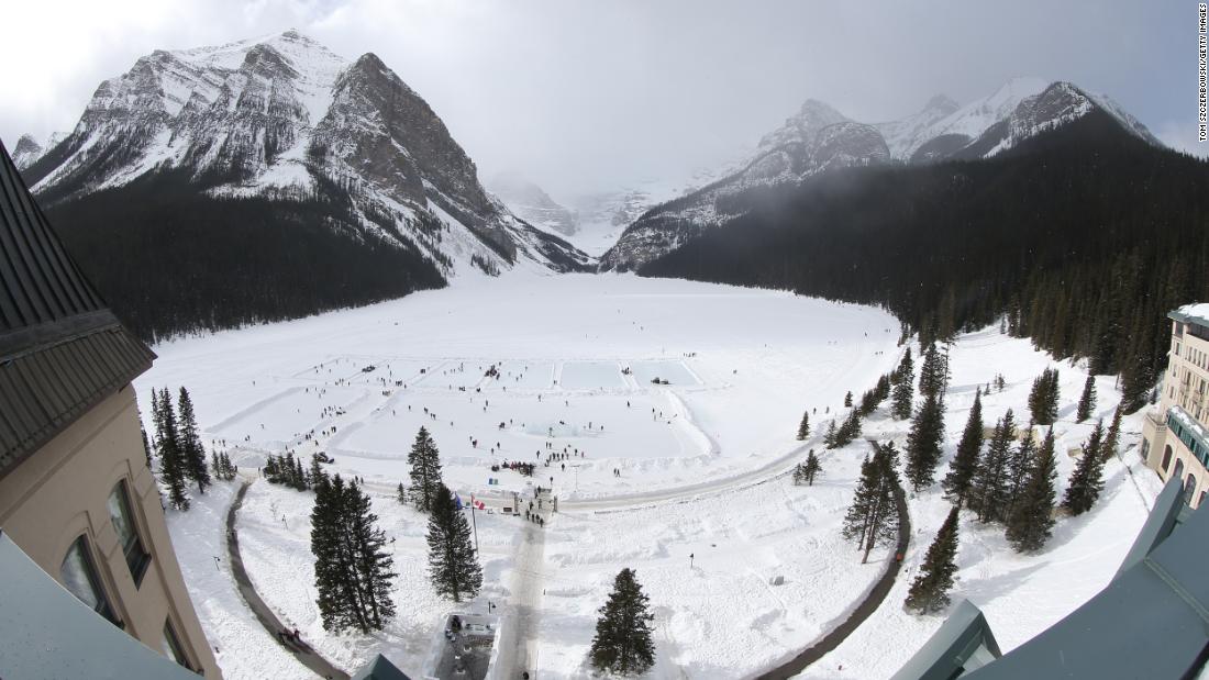 An annual ice hockey tournament takes place on the frozen lake outside the Chateau Lake Louise.