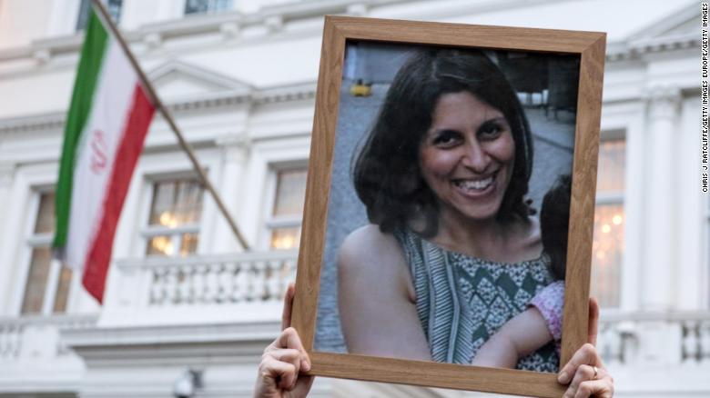 Supporters hold a photo of Nazanin Zaghari-Ratcliffe during a vigil for the British-Iranian mother outside the Iranian Embassy in London, in January 2017.