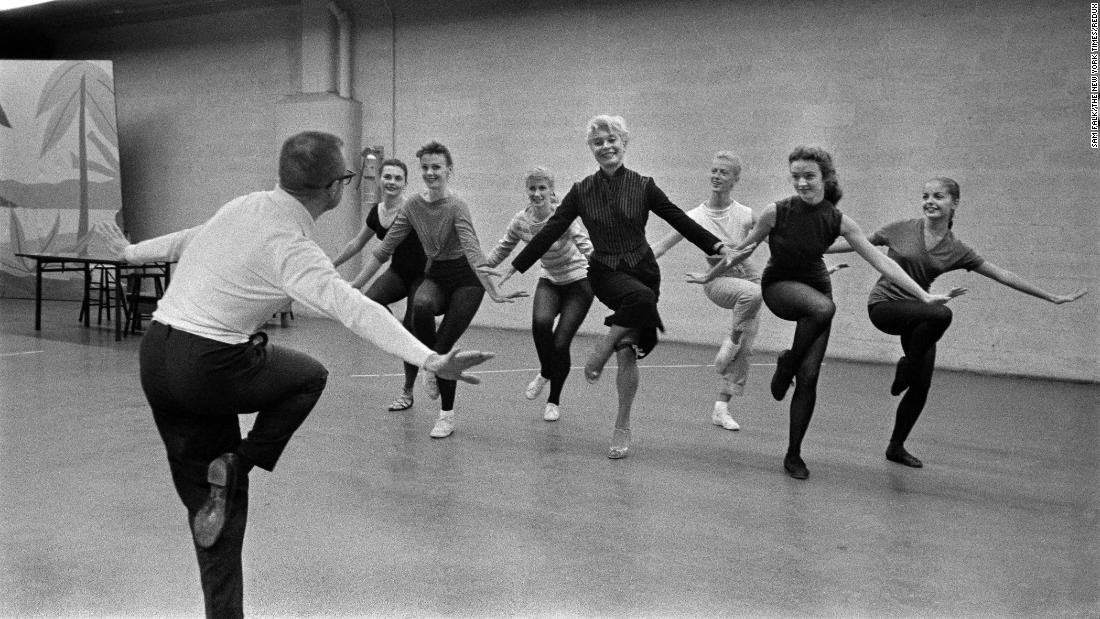 Channing, center, rehearses for a musical on CBS with choreographer Eugene Loring in 1957.