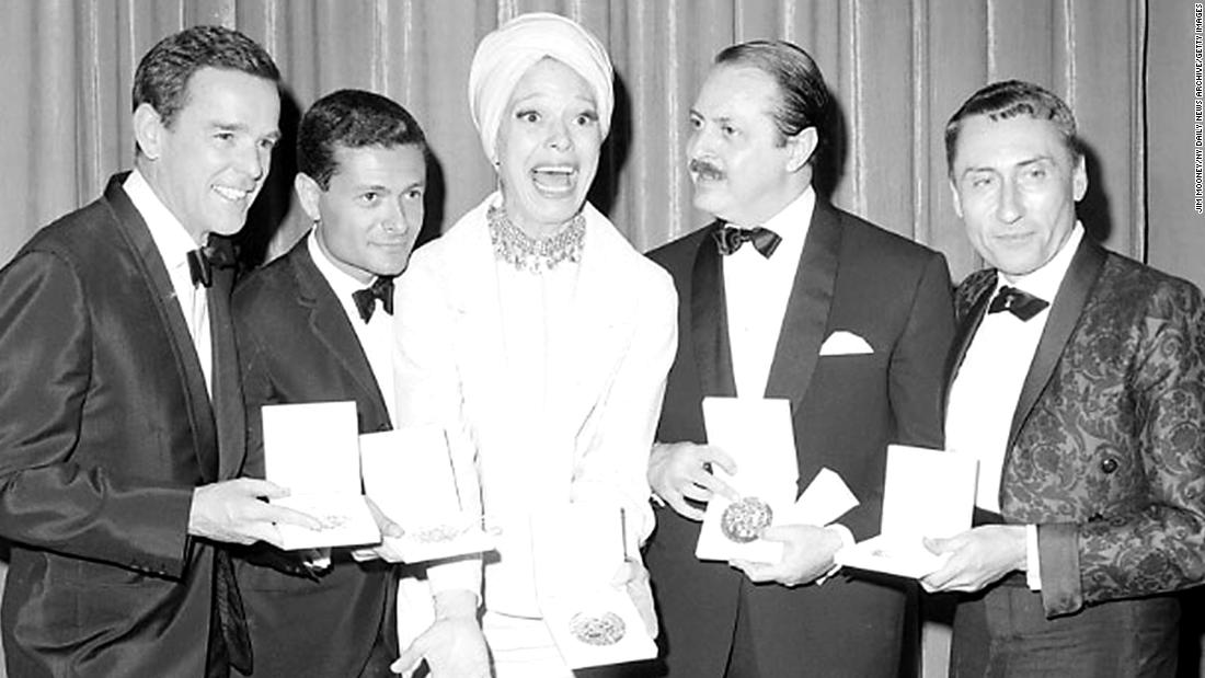 Channing celebrates her Tony win alongside &quot;Hello Dolly!&quot; director Gower Champion, composer and lyricist Jerry Herman, producer David Merrick and costume designer Freddy Wittop in 1964. The original production won 10 Tony Awards.