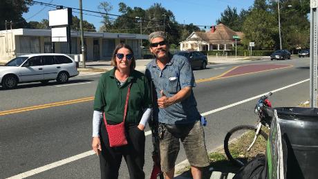 Shannon Lee and Carlo Troche wait at the bus stop in southeast Seminole Heights in Florida.