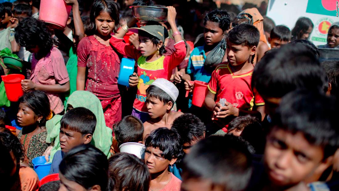 Rohingya children wait to receive food from an aid group at a refugee camp in Ukhiya, Bangladesh, on Tuesday, November 14. More than 600,000 of the Rohingya Muslim minority group from Myanmar&#39;s Rakhine state have fled to Bangladesh, according to the United Nations.