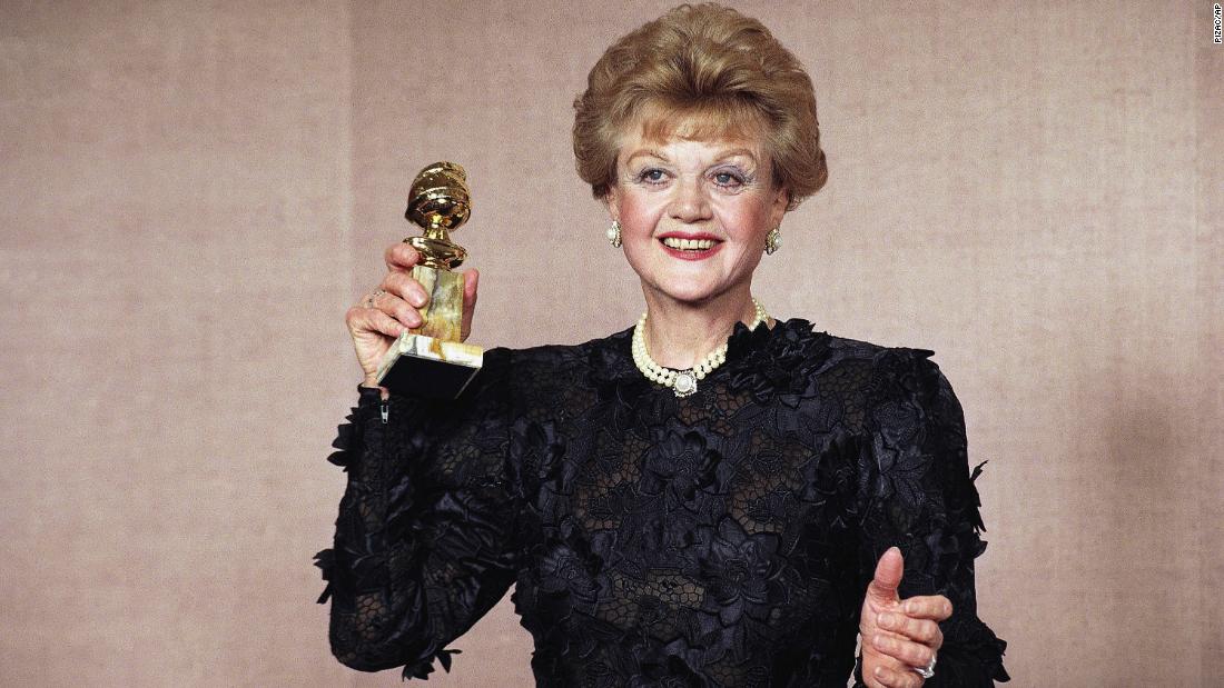 Lansbury holds up the Golden Globe she won in 1990 for her role in &quot;Murder, She Wrote.&quot;
