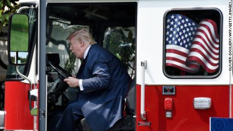 President Donald Trump examines a fire truck from Wisconsin-based manufacturer Pierce on the South Lawn during a &quot;Made in America&quot; product showcase event at the White House in Washington, DC, on July 17, 2017.  / AFP PHOTO / Olivier Douliery        (Photo credit should read OLIVIER DOULIERY/AFP/Getty Images)