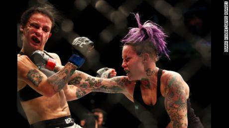 Rawlings (R) punches Jessica-Rose Clark of Australia in their women's UFC flyweight bout in 2017