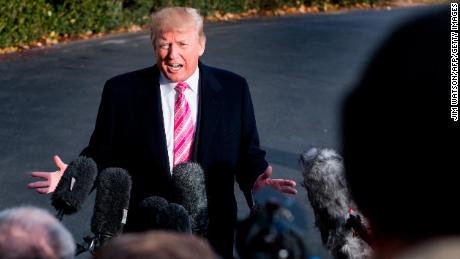 US President Donald Trump talks to reporters during his departure at the White House in Washington, DC, on November 21, 2017. / AFP PHOTO / JIM WATSON        (Photo credit should read JIM WATSON/AFP/Getty Images)