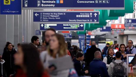 Passengers walk in Terminal 3 at O&#39;Hare airport in Chicago, Tuesday, Nov. 21, 2017. Officials with the Illinois Department of Transportation and Illinois State Police say the ramped up enforcement efforts involving more than 150 law enforcement agencies will end early Monday. (AP Photo/Nam Y. Huh)