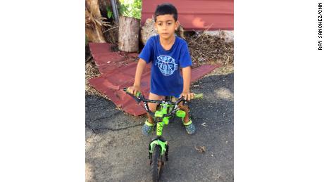 Elian Nieves, 6, gave his donated clothes to friends who were needier.