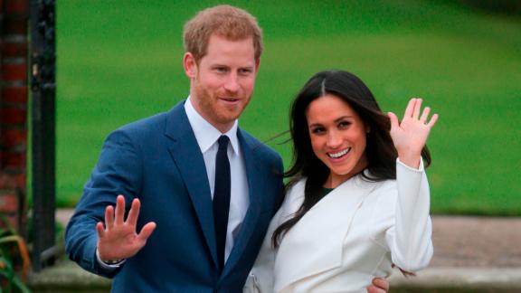 Markle and Prince Harry pose for a photo at Kensington Palace following the <a href=