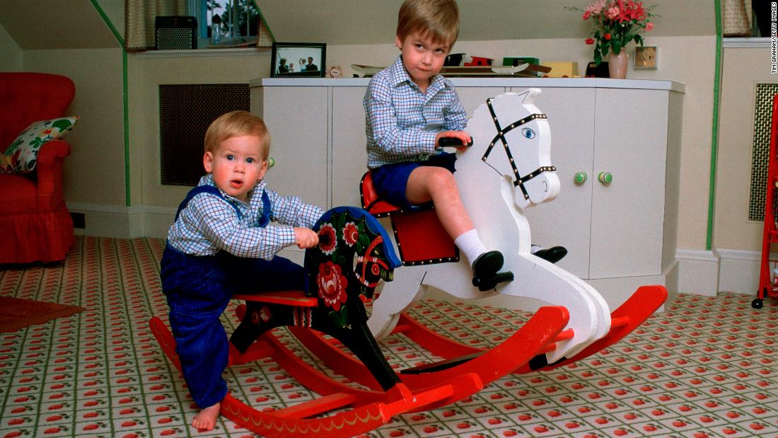 Harry, left, and William play on rocking horses at Kensington Palace.