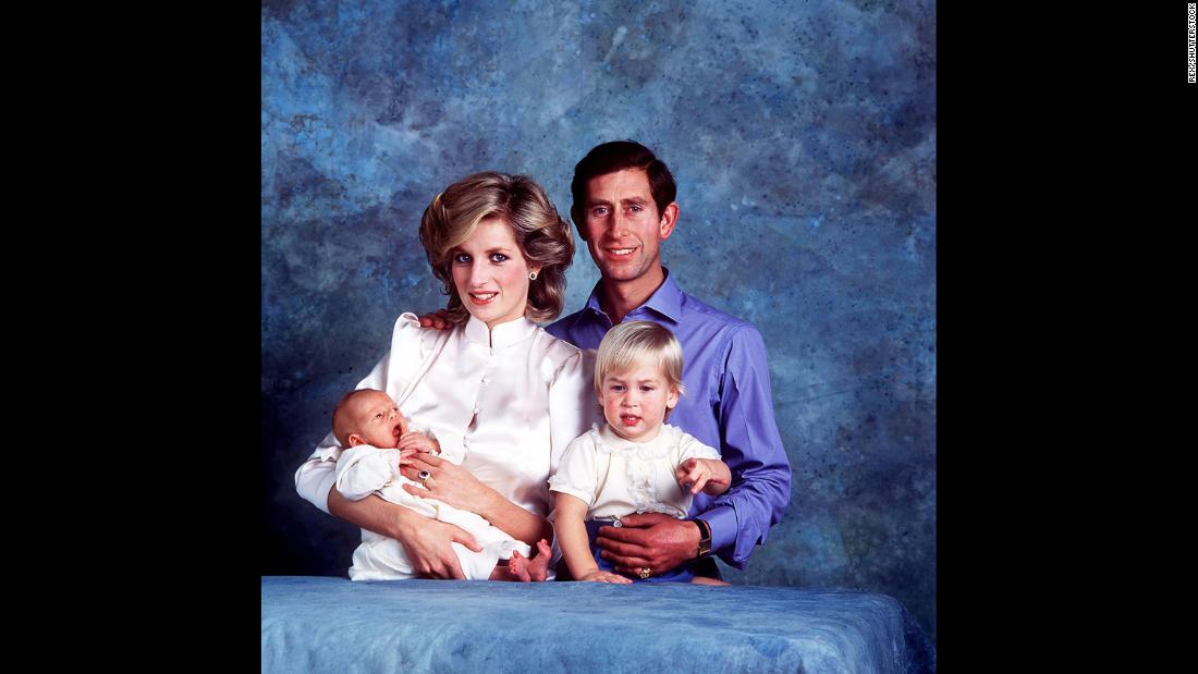 Harry is held by his mother during this family photo with his dad and his brother, Prince William, in 1984.