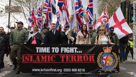 Leaders of Britain First Jayda Fransen, second from right, and Paul Golding, third from left, lead a march in London on April 1, 2017.