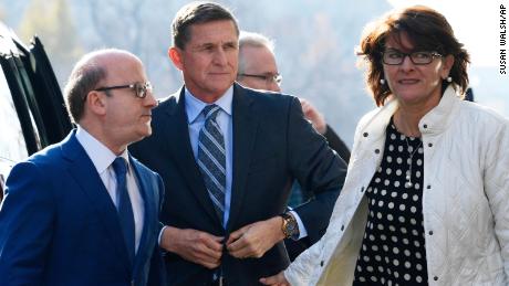 Former Trump national security adviser Michael Flynn, center, arrives at federal court in Washington, Friday, Dec. 1, 2017. Court documents show Flynn, an early and vocal supporter on the campaign trail of President Donald Trump whose business dealings and foreign interactions made him a central focus of Mueller&#39;s investigation, will admit to lying about his conversations with Russia&#39;s ambassador to the United States during the transition period before Trump&#39;s inauguration.  (AP Photo/Susan Walsh)