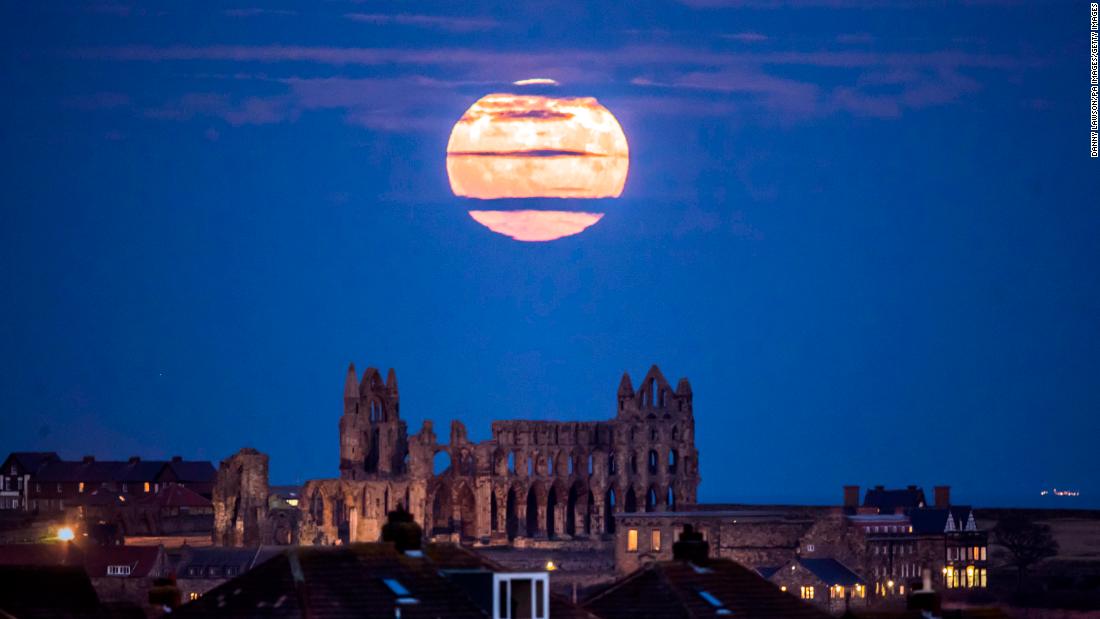 The supermoon rises above Whitby Abbey in Yorkshire, England.
