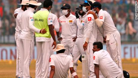 Sri Lanka&#39;s cricket team wears anti-pollution masks as they play the second day of their third test match in New Delhi, on Sunday December 3. 

