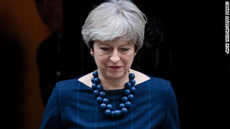 May, pictured on December 5, headed to Brussels just hours after her Commons defeat. 