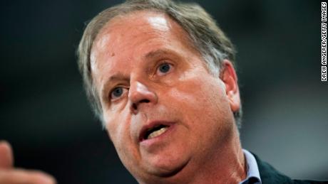 Democratic candidate for U.S. Senate Doug Jones takes questions from reporters at a fish fry campaign event at Ensley Park, November 18, 2017 in Birmingham, Alabama. Jones has moved ahead in the polls of his Republican opponent Roy Moore, whose campaign has been rocked by multiple allegations of sexual misconduct. (Photo by Drew Angerer/Getty Images)