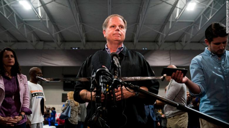 BIRMINGHAM, AL - NOVEMBER 18: Democratic candidate for U.S. Senate Doug Jones takes questions from reporters at a fish fry campaign event at Ensley Park, November 18, 2017 in Birmingham, Alabama. Jones has moved ahead in the polls of his Republican opponent Roy Moore, whose campaign has been rocked by multiple allegations of sexual misconduct. (Photo by Drew Angerer/Getty Images)