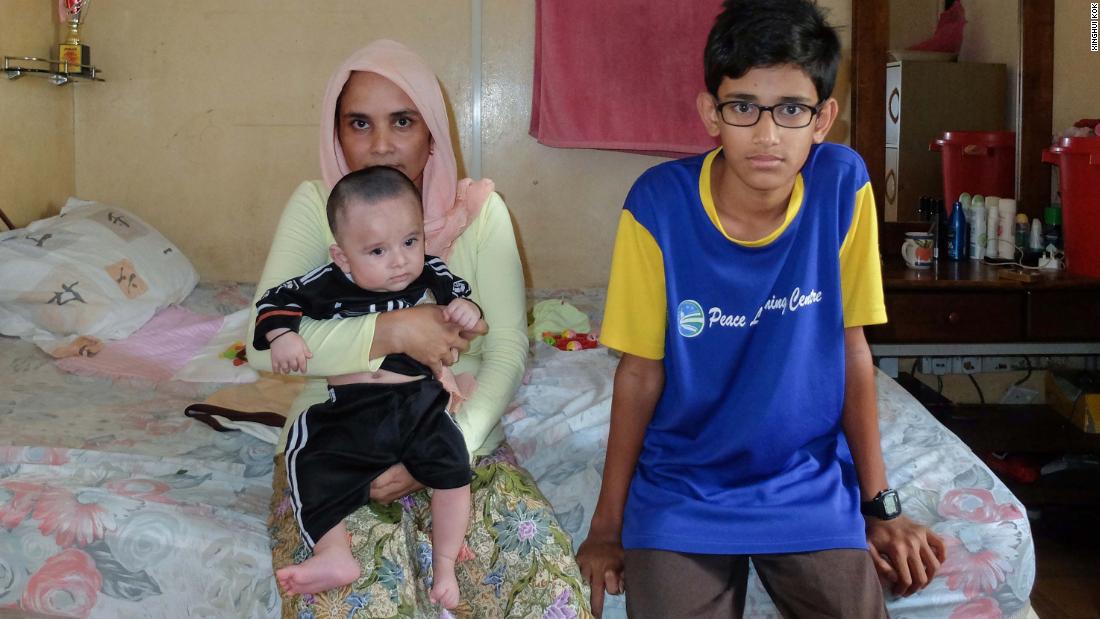 Madam Jubairah Bashir, 34, in her rented room with her son Mohammed Arafat Bashir 13, and her five-month-old infant Mohammed Fahet Bashir. She says she&#39;s happy her family is together but would like to return to Myanmar.