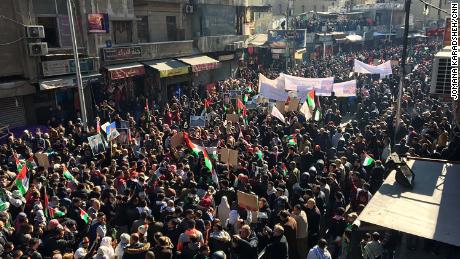 Protesters march through Amman, Jordans capital, on Friday.
