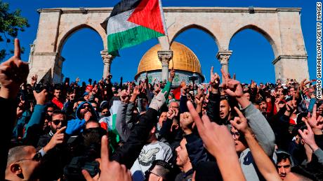Palestinian Muslim worshippers shout slogans during Friday prayers near the al-Aqsa mosque compound in Jerusalems Old City.