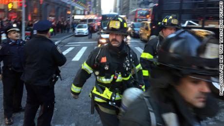 Firefighters arrived on Eighth Avenue near the scene of a reported explosion on Monday morning in Manhattan, New York, December 11, 2017. (David Scull/The New York Times)