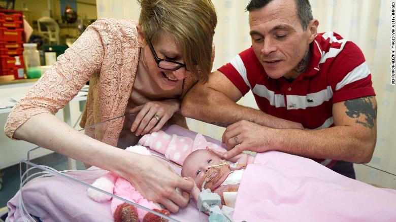 Three-week-old Vanellope Hope Wilkins, with her parents Naomi Findlay and Dean Wilkins, at Glenfield Hospital in Leicester.