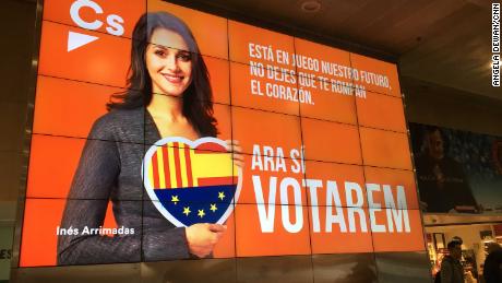 An electronic campaign poster of Inés Arrimadas, lead candidate for the anti-independence  Ciutadans party, at the Barcelona Sants train station.