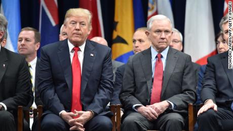President Donald Trump sits with Attorney General Jeff Sessions on December 15, 2017 in Quantico, Virginia, before participating in the FBI National Academy graduation ceremony.