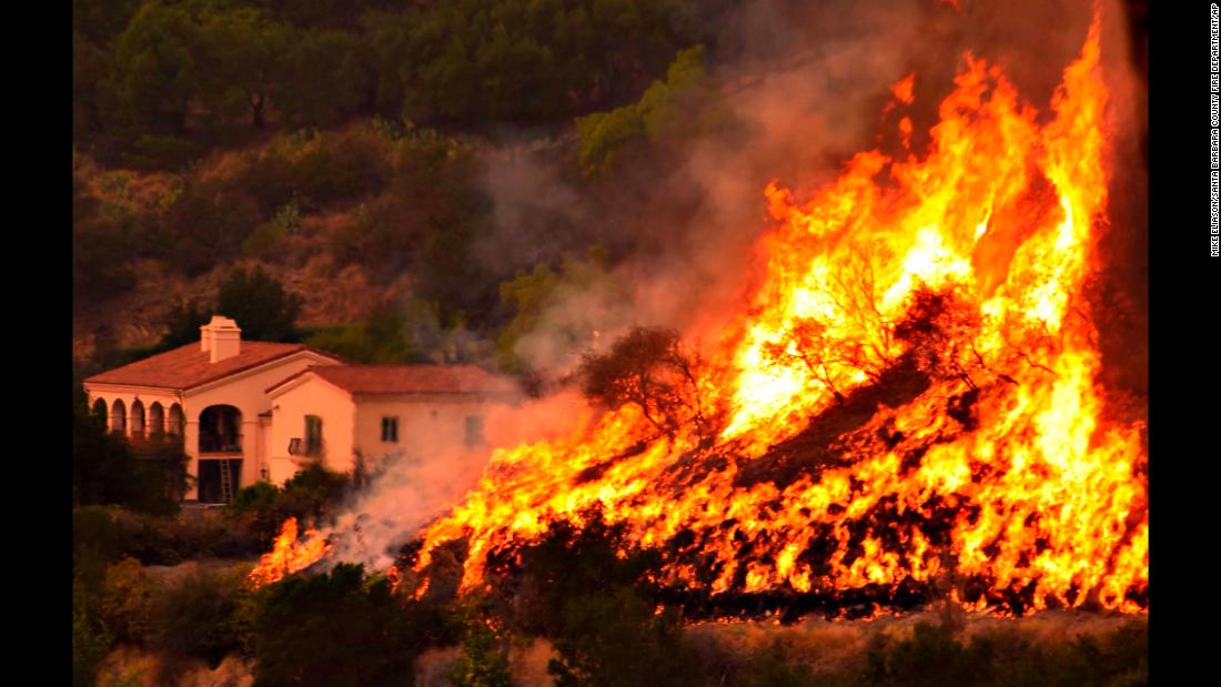 Flames from a back-firing operation rise behind a home off Ladera Lane near Bella Vista Drive in Santa Barbara, California, on Thursday, December 14. Powerful Santa Ana winds and extremely dry conditions are fueling &lt;a href=&quot;http://www.cnn.com/2017/12/07/us/ventura-fire-california/index.html&quot; target=&quot;_blank&quot;&gt;wildfires in Southern California&lt;/a&gt; in what has been a devastating year for &lt;a href=&quot;http://www.cnn.com/interactive/2017/12/us/california-wildfires-cnnphotos/&quot; target=&quot;_blank&quot;&gt;such natural disasters in the state.&lt;/a&gt;