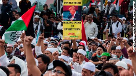 Protesters show banners and shout slogans in the Indonesian capital of Jakarta. 