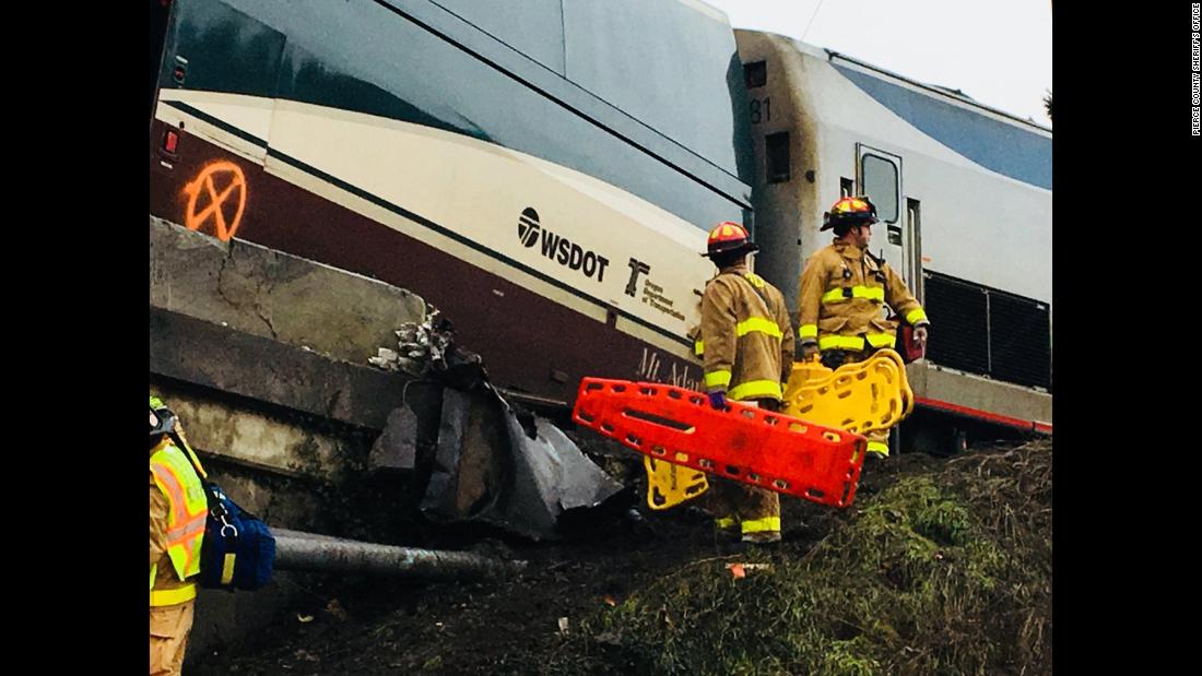 First responders work at the scene of the crash on December 18.