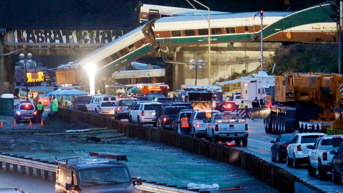 Emergency workers respond to the derailment shortly after it happened on Monday, December 18.