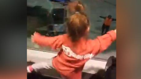 Two little girls have a dance-off with Southwest Airlines employee.