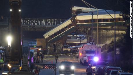 DUPONT, WA - DECEMBER 18: Work crews prepare to clear southbound I-5 lanes at the scene of an Amtrak train derailment on December 18, 2017 in DuPont, Washington. At least six people were killed when several train cars plunged from the bridge. (Photo by Stephen Brashear/Getty Images