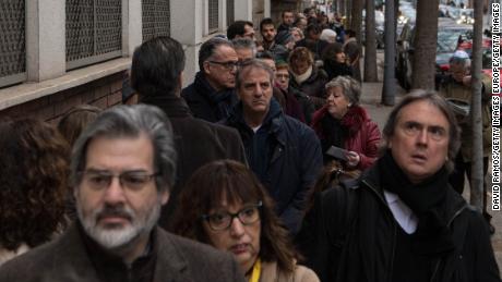 Voters line up outside a polling station in Barcelona, Spain. 