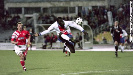 PSG's George Weah kicks the ball during a Champions League match against Spartak Moscow in 1994.